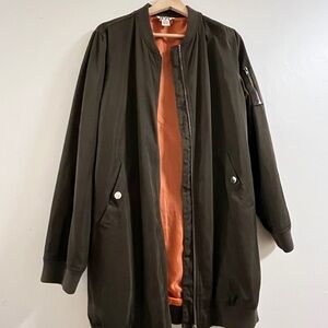 olive green jacket with orange inside